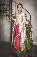 Beautiful woman in old historic medieval dress