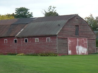 Vintage Red Wooden Barn in the Countryside; Farming, Agriculture, Business, Travel, Peaceful and Rural
