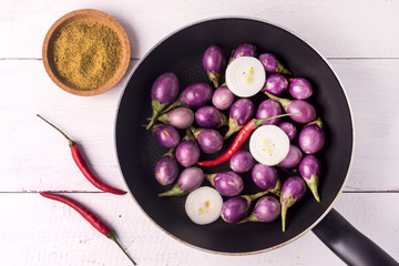 Organic Raw Baby Indian Eggplants in a Pan Top View Flat Lay Raw Eggplants Wooden Background