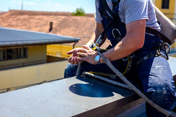 Industrial climber is prepare his ropes