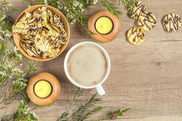 Cup of coffee with milk, chocolate, delicious nutritious cereal breads