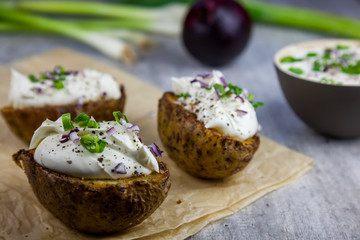 Baked jacket potatoes stuffed with curd and spring onion