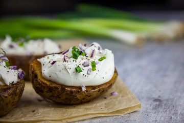 Baked jacket potatoes stuffed with curd and spring onion