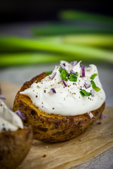 Baked jacket potatoes stuffed with curd and spring onion