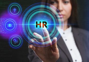 The concept of business, technology, the Internet and the network. A young entrepreneur working on a virtual screen of the future and sees the inscription: HR