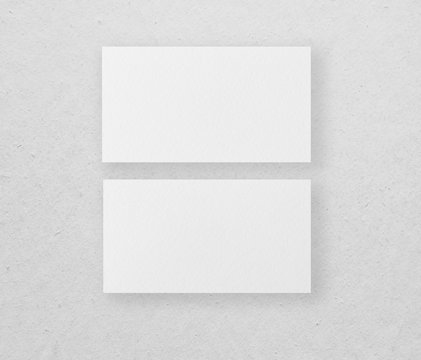 Mockup of two horizontal business cards at grey background.
