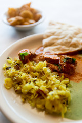 Indian tikka masala with cabbage and naan