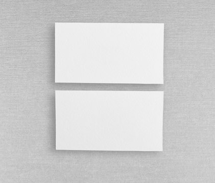 Mockup of two horizontal business cards at grey background.