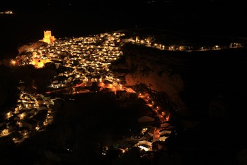 Views of the illuminated village of Alcala del Jucar at night from the viewpoint