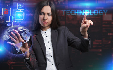 The concept of business, technology, the Internet and the network. A young entrepreneur working on a virtual screen of the future and sees the inscription: Technology