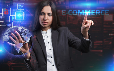 The concept of business, technology, the Internet and the network. A young entrepreneur working on a virtual screen of the future and sees the inscription: E-commerce