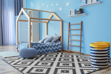 Comfortable bed in modern children room