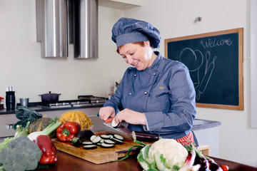 female private chef preparing a vegetable meal in kitchen