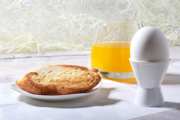 Morning Breakfast set with egg, bread toast and orange juice.