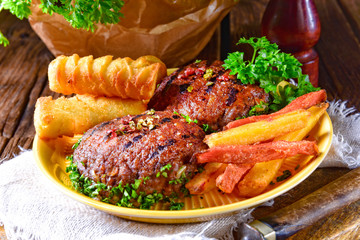 grilled bullets with croquettes and vegetables