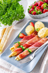 asparagus ham rolls with strawberries and hollandaise