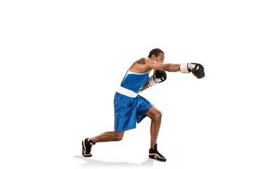 Obraz premium Sporty man during boxing exercise. Photo of boxer on white background