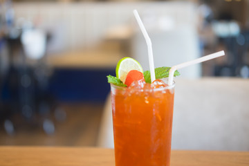 Ice tea with lemon, cherry and mint