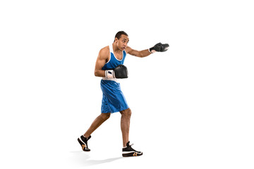 Sporty man during boxing exercise. Photo of boxer on white background
