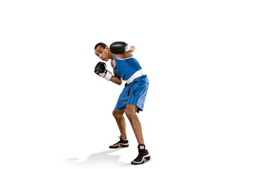 Sporty man during boxing exercise. Photo of boxer on white background