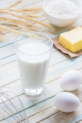 Ingredients for baking: milk, flour, egg and butter