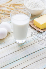 Ingredients for baking: milk, flour, egg and butter
