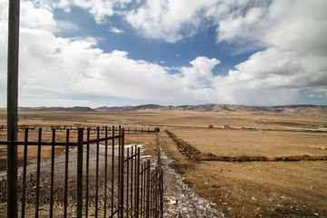View of land, mountain and cloudy sky outside the city of Ulaanbaatar, Mongolia