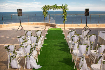 Beautiful Romantic Wedding Ceremony Decorations. Outdoor Set up near the sea