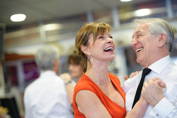 Senior couple attending dance class
