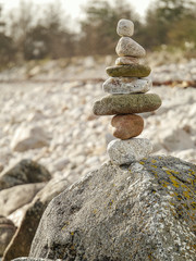 Tower made of rocks on a big stone, concept balance, patience, art, craft