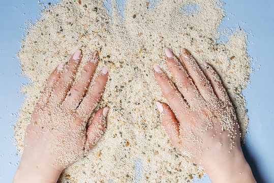 Hands holding sand