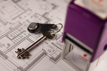 Stamp and keys on plan of house background