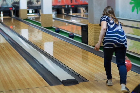 Girl playing bowling