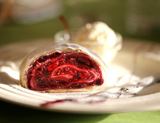 Photo of a macro of delicious bright strudel with cherry