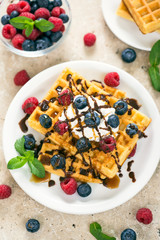 Fresh homemade waffles with blueberries and raspberries