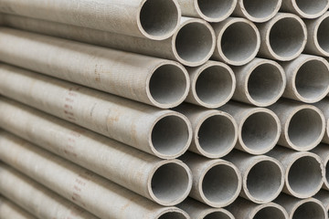 asbestos pipes in a stack in a warehouse or in a building store