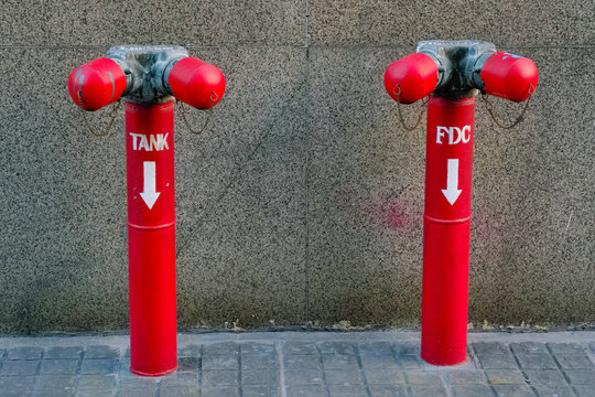 A water valve tank and FDC (Fire Department Connection) at the outside of building.
