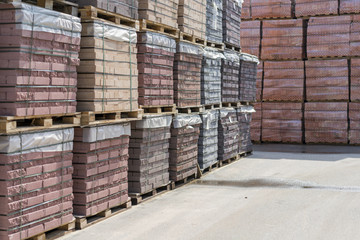 pallets with bricks in the building store. Racks with brick. Masonry, stonework.
