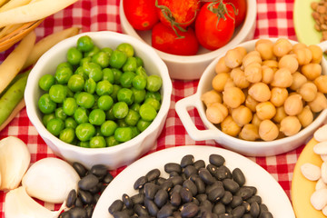 variety of kitchen ingredients with fresh and dried legumes
