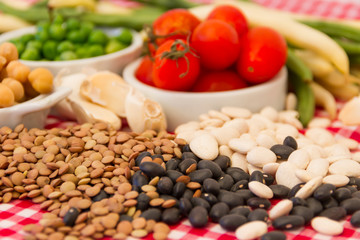 variety of kitchen ingredients with fresh and dried legumes