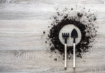 wooden background concept earth piled circle dish rake fork texture landing center spring...