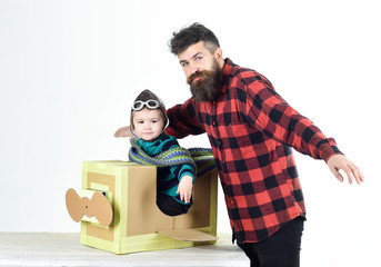 Child care. Child pilot aviator with airplane dreams of traveling.