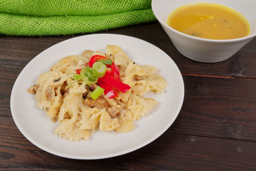Wholemeal pasta baked with cabbage on a table