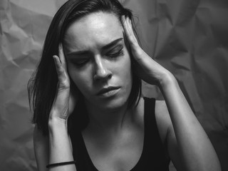 Headache or stress. Portrait of young woman