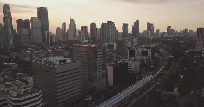 JAKARTA - Indonesia. April 11, 2018: Aerial view of Jakarta downtown from a drone with skyscrapers background on sunset time. Shot in 4k resolution
