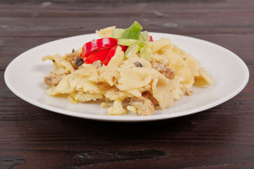 Wholemeal pasta baked with cabbage on a table