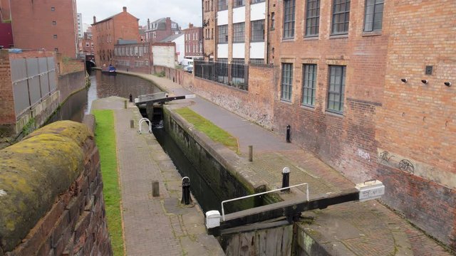Canal, lock and barge on part of the Birmingham Canal Network.