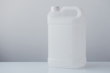 White plastic jerrycan canister for chemical liquids