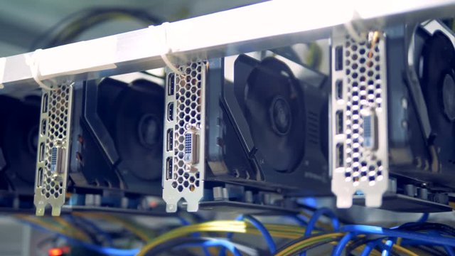 Rotating reels of graphic cards during cryptocurrency mining