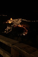 Views of the illuminated village of Alcala del Jucar at night from the viewpoint